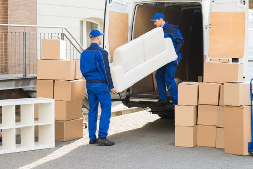 Professional movers packing belongings